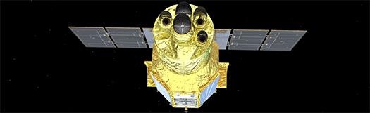 An artist's concept of the XRISM spacecraft. The spacecraft has a cylindrical shape toward the front and a hexagonal shape towards the rear. The craft is wrapped in shiny, gold Mylar-like sheathing. A rectangular structure of solar panels is attached to the top rear of the observatory, overlapping the spacecraft on both sides.